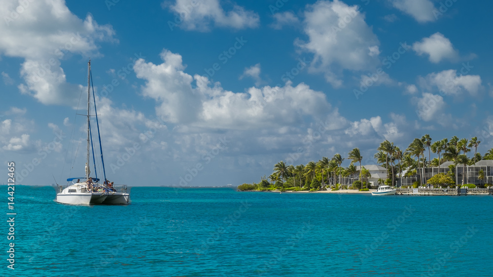 Catamaran on the Caribbean sea arriving at Kaibo, Grand Cayman, Cayman Islands