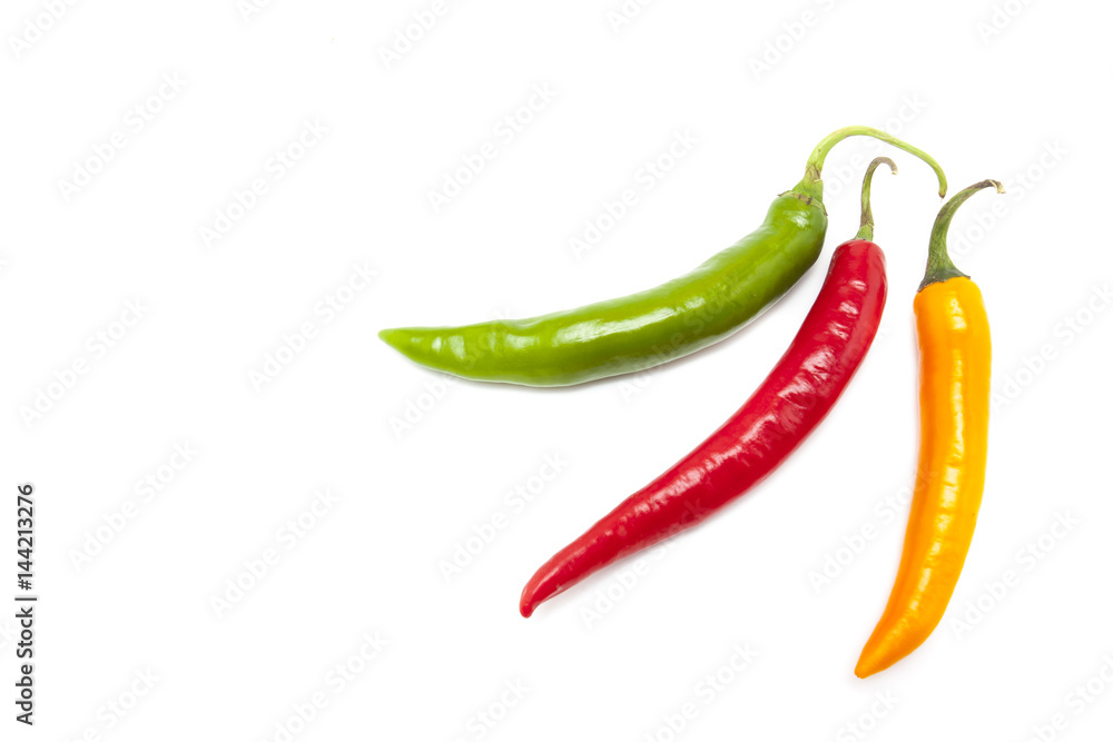 Red, orange and green chili on white background, isolate image