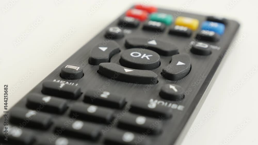 DVB-T infrared remote device on white background 4K 2160p 30fps UltraHD tilting video - Close-up of set-top-box IR controller slow tilt 3840X2160 UHD footage DVB-T infrared remote device on white background 4K 2160p 30fps UltraHD tilting video - Close-up of set-top-box IR controller slow tilt 3840X2160 UHD footage