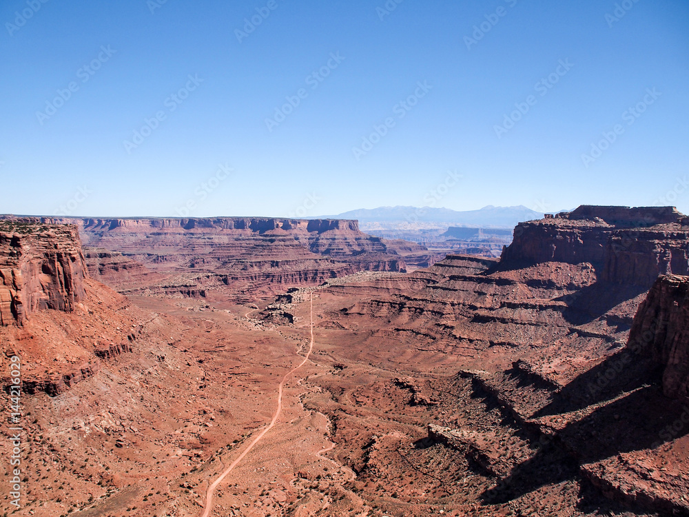 Dirt road viewed from plateau at Canyonlands National Park near Moab, Utah, United States