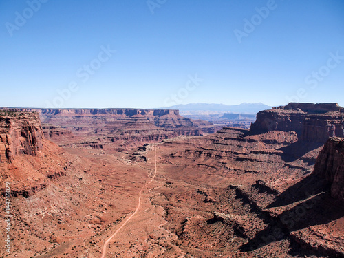 Dirt road viewed from plateau at Canyonlands National Park near Moab, Utah, United States