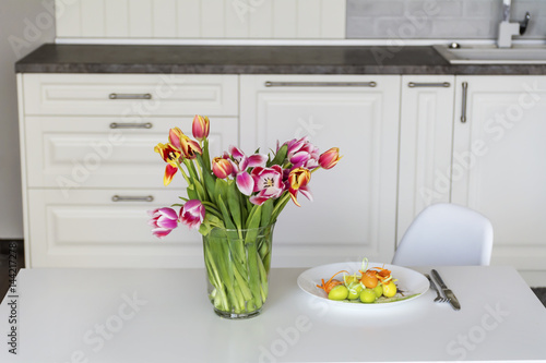 easter home decoration with tulips and eggs