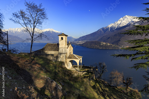Wallpaper Mural Chiesa di Sant'Eufemia, a little church over Musso surrounded by Como lake scenery, Province of Como, Lombardy, Italy Torontodigital.ca