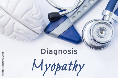 Diagnosis of Myopathy. Anatomical brain figure, neurological hammer and stethoscope lying on sheet of paper or book with the title neurological diagnosis of Myopathy. Concept for neurology photo