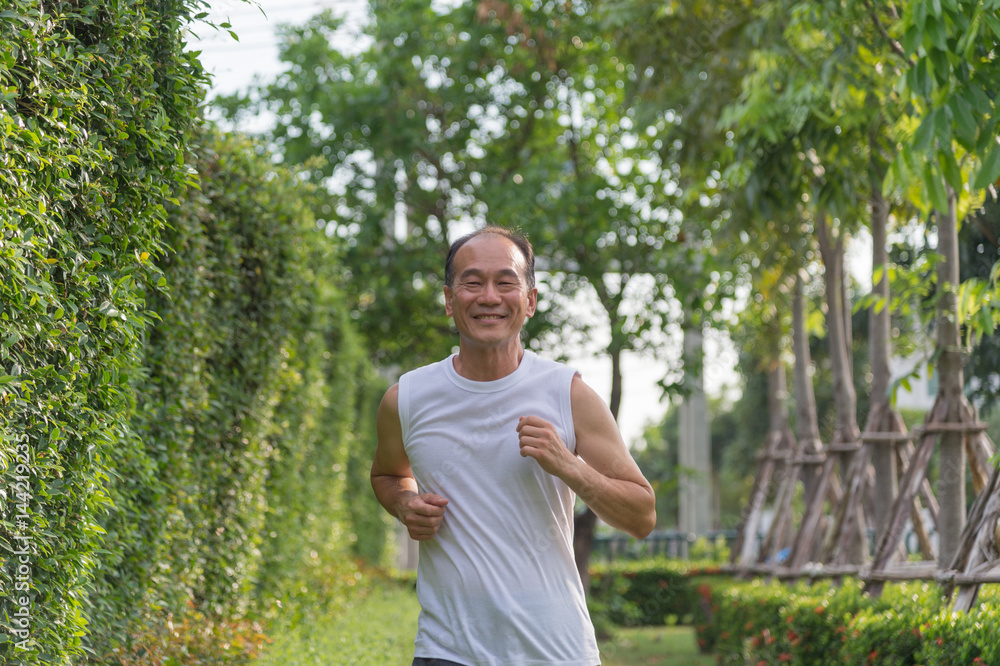 old man exercise by jogging at the park, health concept old man exercise by jogging at the park, health concept