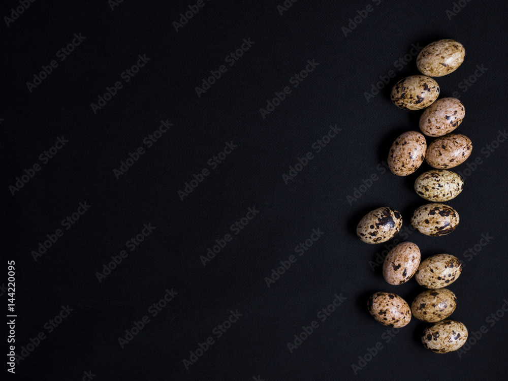 Chocolate easter eggs in pattern isolated on black background Chocolate easter eggs in pattern isolated on black background