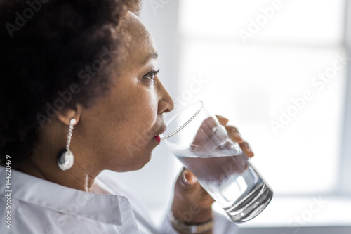 Portrait Of Girl african drinking water photo