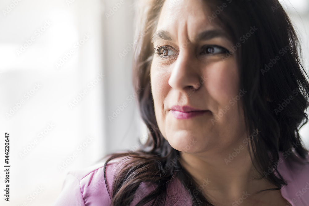 Shot of a beautiful mid adult woman smiling Shot of a beautiful mid adult woman smiling