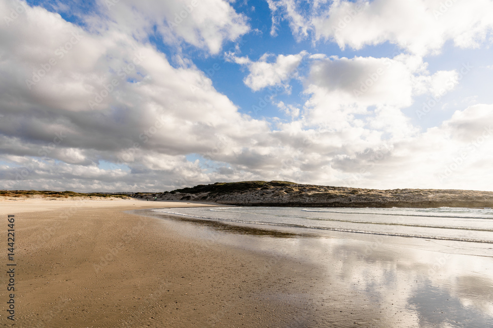 Beach, sand and reflection of sky in clear sea water. Summer season sunny day vacation concept Beach, sand and reflection of sky in clear sea water. Summer season sunny day vacation concept