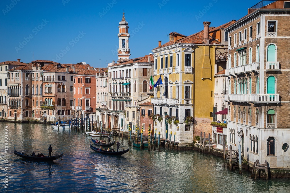 Venice, Veneto, Italy. Sunny view of some Venice canal, with goondolas passing trough. Venice, Veneto, Italy. Sunny view of some Venice canal, with goondolas passing trough.