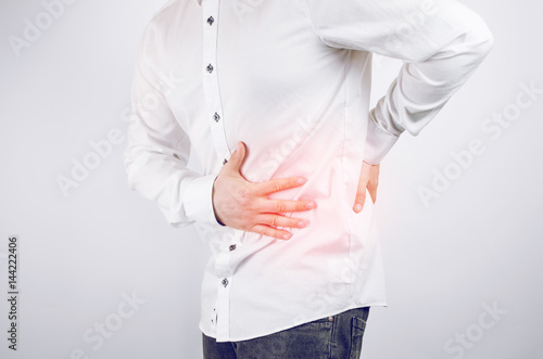 Closeup Shot Of Man In White Shirt Feeling Pain In The Waist, Kidney On White Background