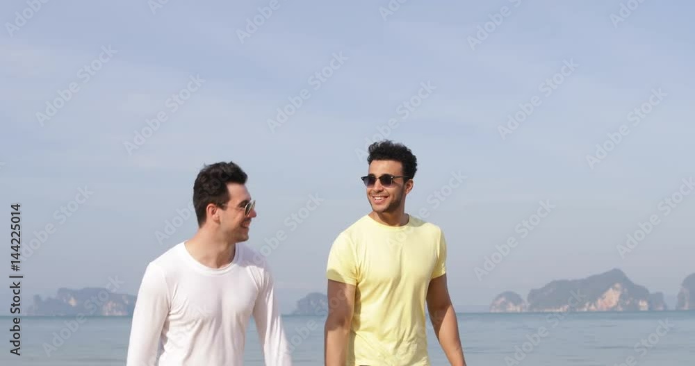 Two Man Walking Along Beach Talking, Happy Smile Gay Couple Communication Tourists On Sea Slow Motion 60 Two Man Walking Along Beach Talking, Happy Smile Gay Couple Communication Tourists On Sea Slow Motion 60