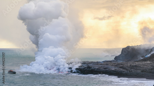 Amazing view of lava pouring into the sea in Volcanoes National Park, Big Island, Hawaii