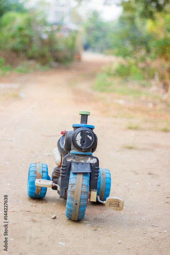 Old motorcycle toy,broken toy with copy space Old motorcycle toy,broken toy with copy space