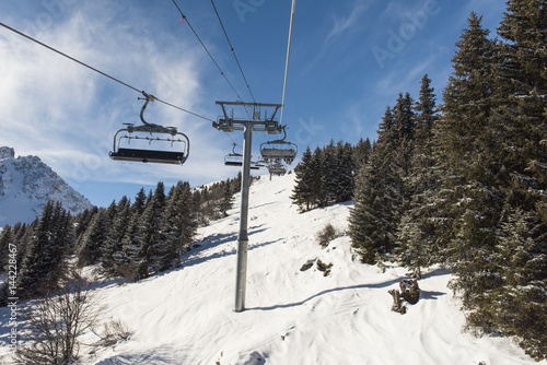 Panoramic view of an alpine mountainside with ski lift © Paul Vinten