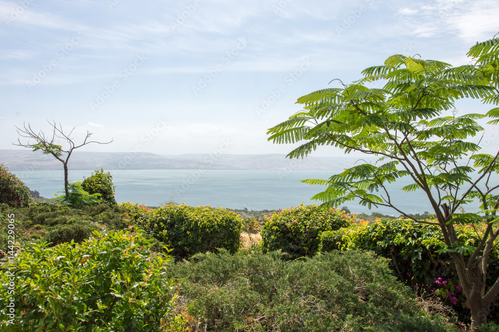 View from the mount of Beatitudes on a misty Sea of Galilee with mountains in the background View from the mount of Beatitudes on a misty Sea of Galilee with mountains in the background