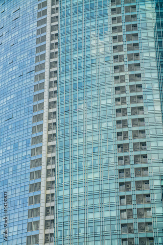 Business Modern architecture close up, texture windows of a high rise building