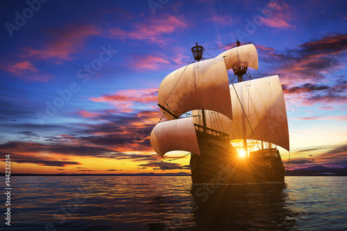 Caravel On The Sunset Background