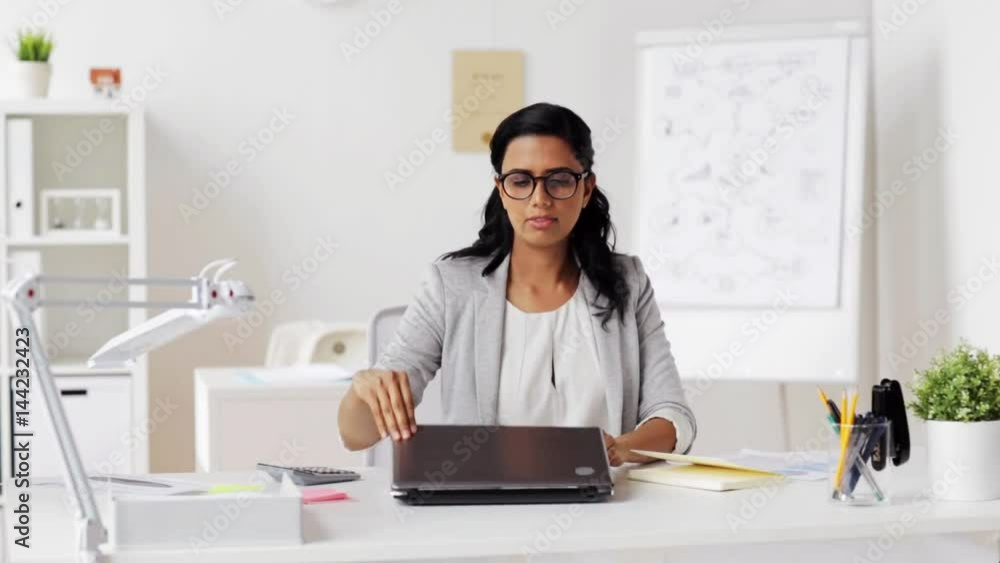 businesswoman with laptop and papers at office businesswoman with laptop and papers at office