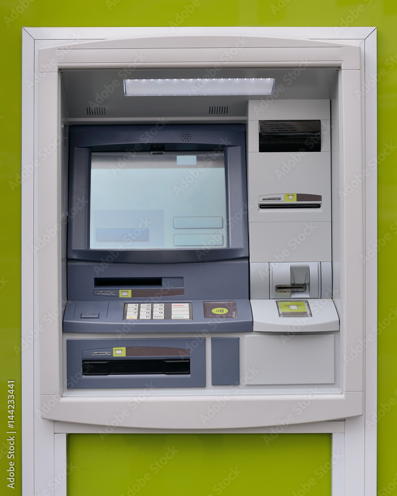 ATM machine on green background ATM machine on green background