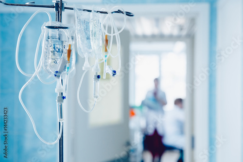 Fototapet Dropper in a vein close-up