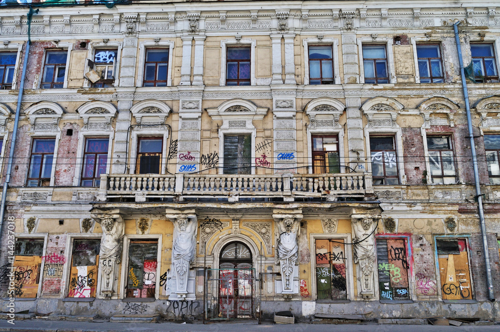 Ruined facade of a tenement house in the historic center of Moscow.