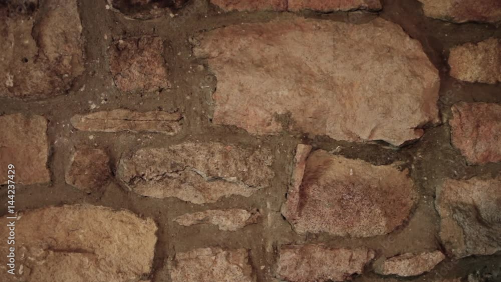 Old stone wall interior of a historic colonial home, background Stock