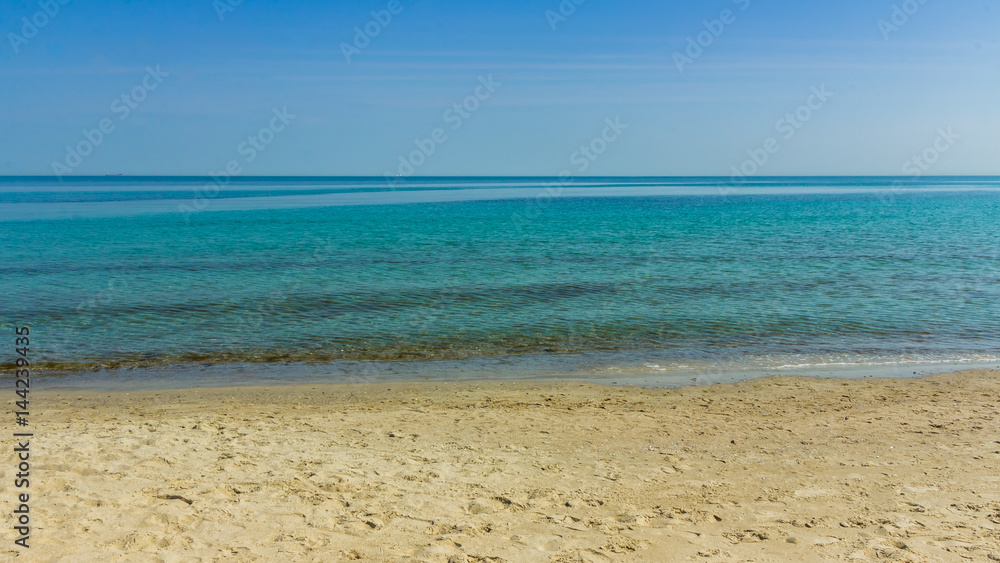 Clear sky and sea landscape. Hot sea summer shot on a sandy beach
