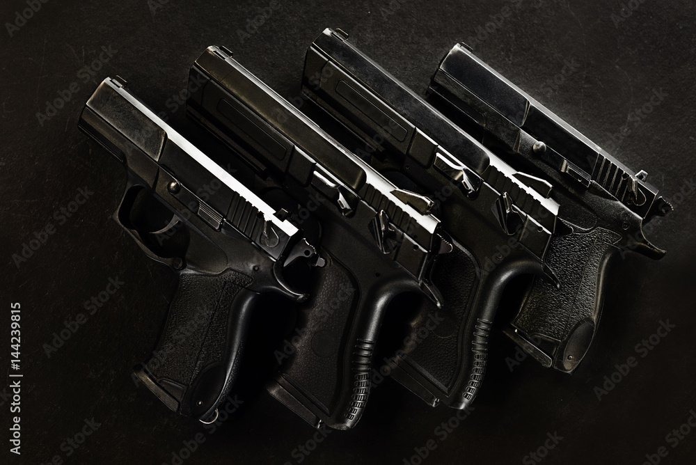 handguns in a row handguns in a row