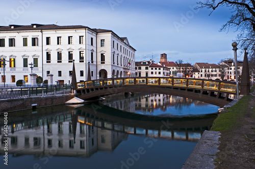 The University Bridge reflects on river Sile in Treviso. Italy