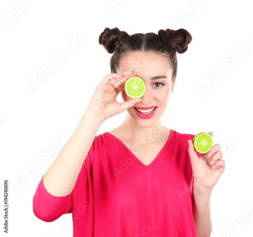 Beautiful young woman with lime on white background