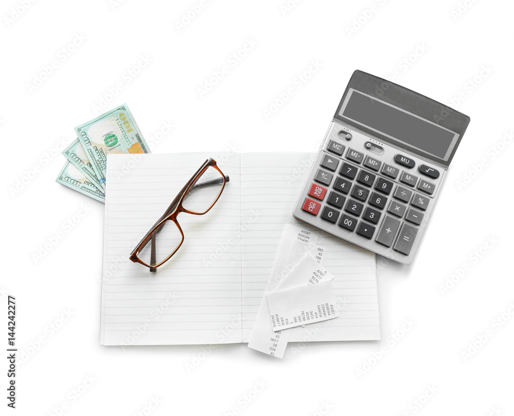 Gray calculator and notebook on white background Gray calculator and notebook on white background