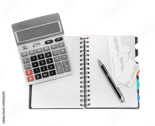 Gray calculator and notebook on white background