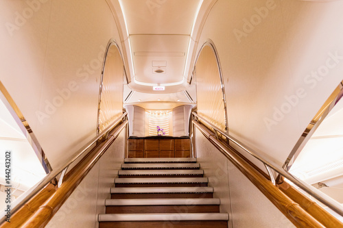 Фотография Interior of a modern aircraft stairs to the upper deck of a luxury large freight aircraft