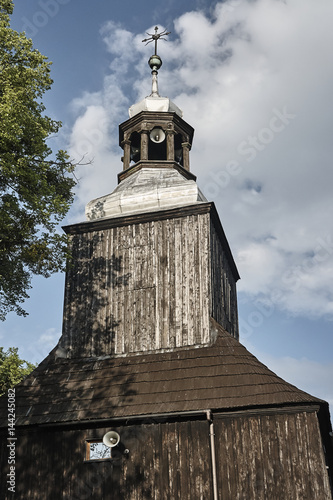 Wooden country church with belfry in Poland.