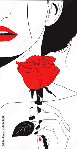 Beautiful woman wounded by a thorn of a red rose