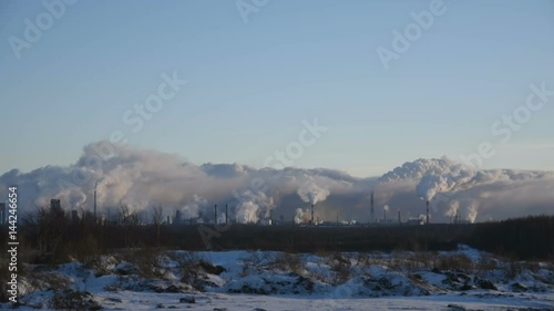 massive air pollution, huge factory smokes on the horizon