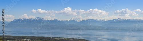 Panoramic view Lake Geneva and surrounding mountains during springtime.
