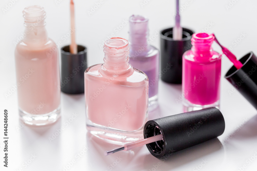 hands care concept with nail polish white desk background hands care concept with nail polish white desk background