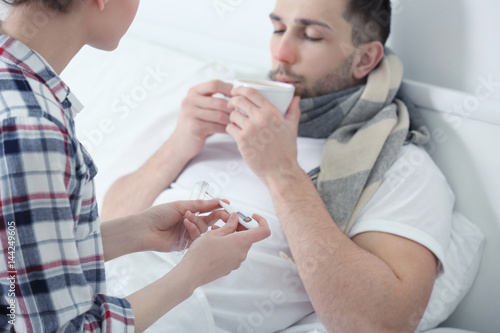 Young woman taking care of ...