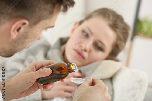 Yong man taking care of ill...