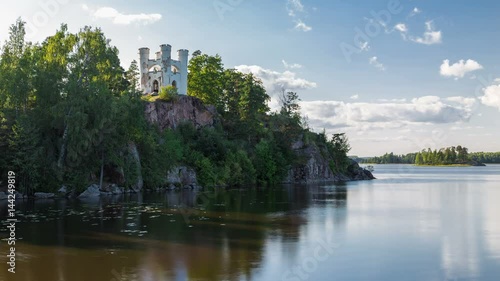 Timelapse of Chapel Ludwigsburg on a rocky island necropolis in the Zashchitnaya Bay, Northern nature, national historical architectural and natural museum reserve the Monrepos Park, Vyborg, Russia. photo