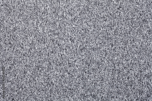 Grey melange knitted fabric made of synthetic fibres textured background