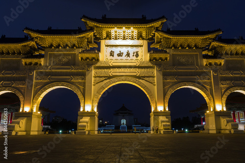 Lit main gate at the Chiang Kai-shek Memorial Hall at dusk in Taipei, Taiwan. © tuomaslehtinen