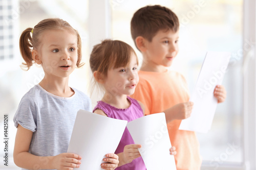 Cute kids singing in music ...