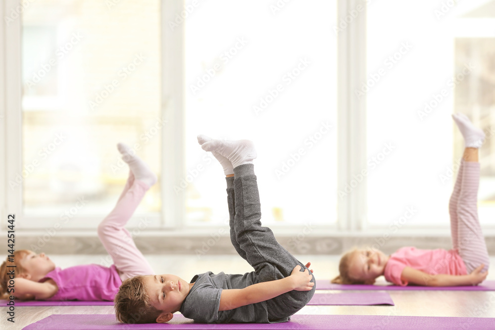 Group of children doing gymnastic exercises Group of children doing gymnastic exercises
