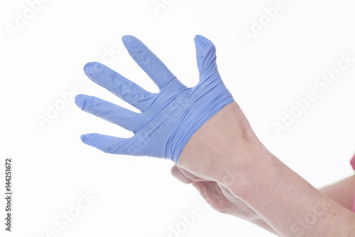 Fototapeta Naklejka Na Ścianę i Meble -  doctor wearing gloves isolated on white studio background. Medicine concept