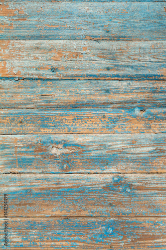  The old wooden background painted with blue paint. Plank wood texture. For design. The vertical pattern has a lot of space for text.