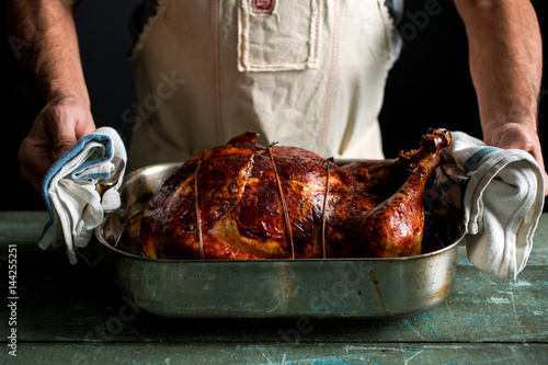 Man serving Thanksgiving turducken photo