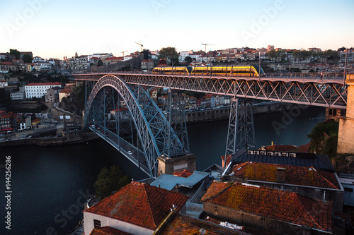 View of the Douro river and Dom Luis I Bridge at dusk, Porto, Portugal.